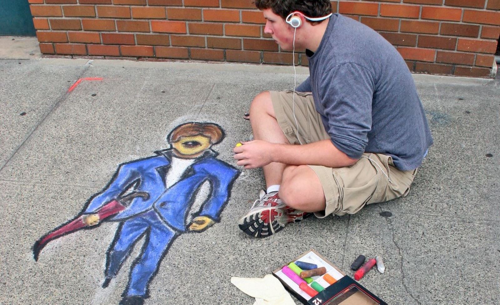 Artist drawing in Chalk